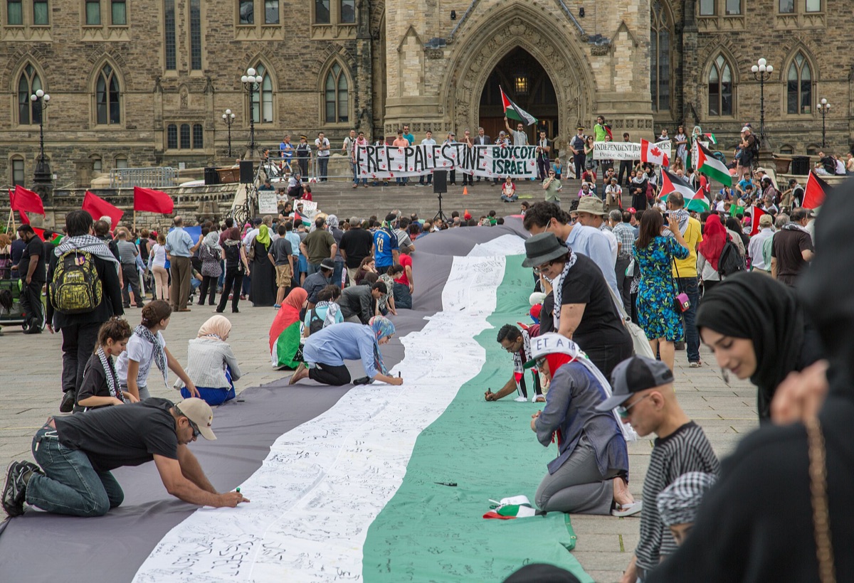 The Canadian flag flying near Parliament Hill in Ottawa