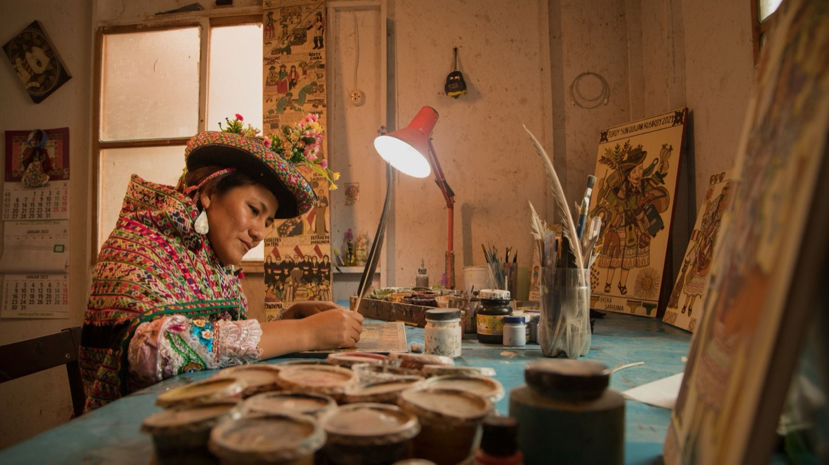 Indigenous artist painting traditional pattern